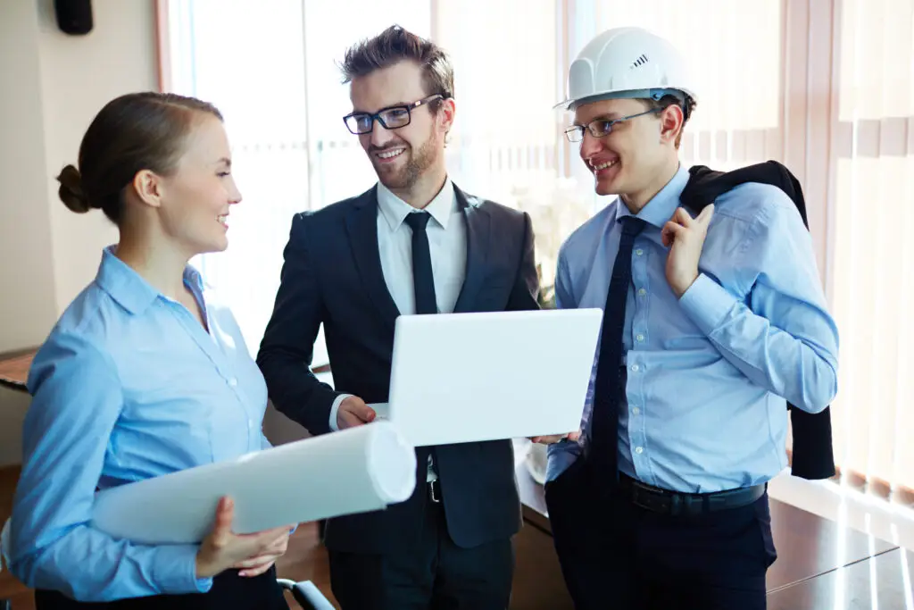 group of professionals discussing building plans