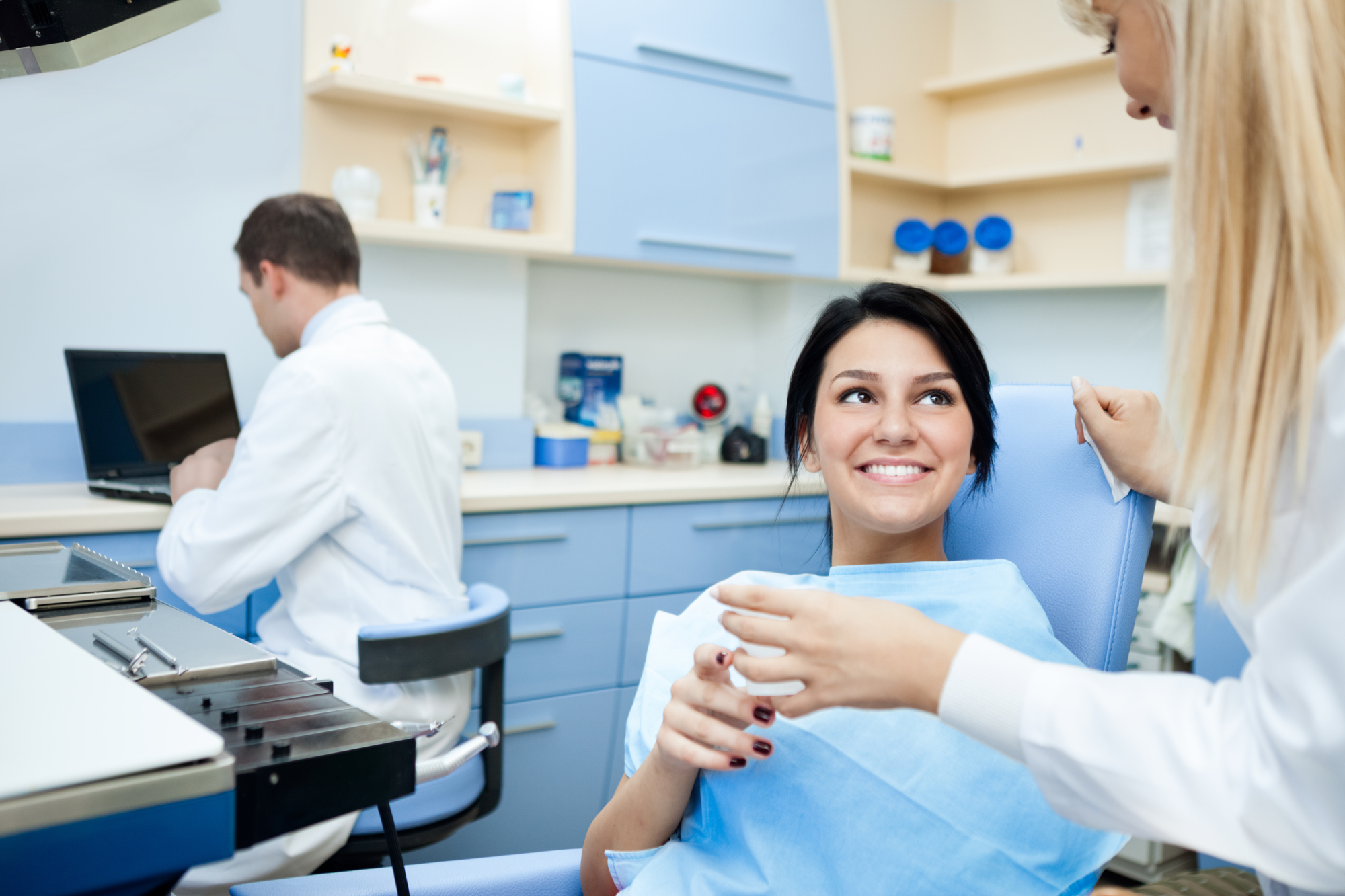 patient getting a teeth cleaning at a dentist office